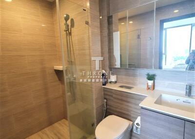 Modern bathroom with shower, toilet, and vanity unit