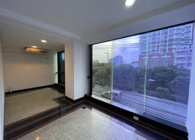 Living area with large windows and city view