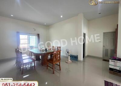 Spacious dining area with large windows and modern furniture