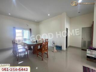 Spacious dining area with large windows and modern furniture