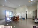 Spacious dining area with large windows and modern furniture