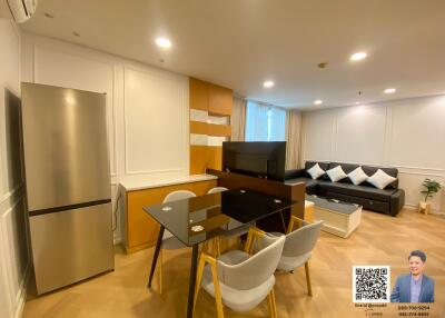 Modern living area with kitchen and seating