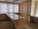 Modern office space with large glass table and ample storage