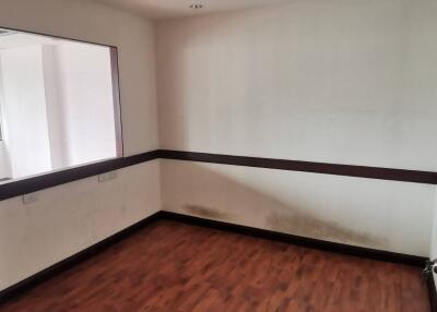 Unfurnished room with window and wooden floor