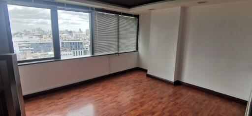 Spacious and empty living room with large windows