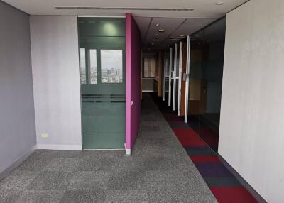 Spacious office hallway with modern glass partitions