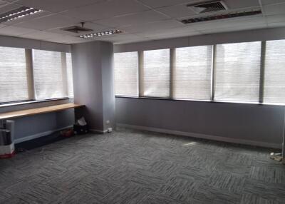 spacious office room with large windows