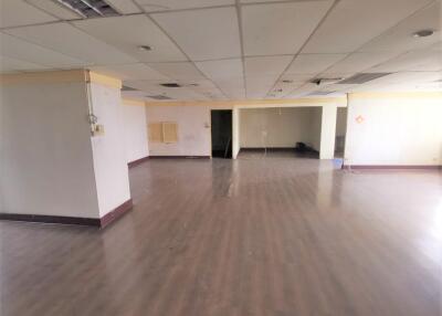 Spacious commercial or office area with wooden flooring