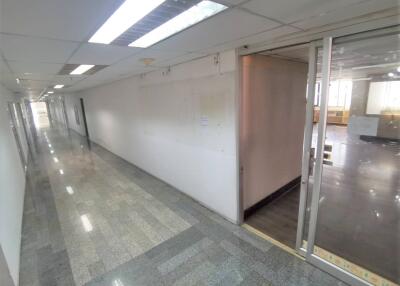 Hallway with tiled flooring and sliding glass door