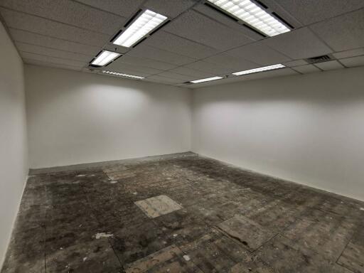 Empty room with fluorescent lighting