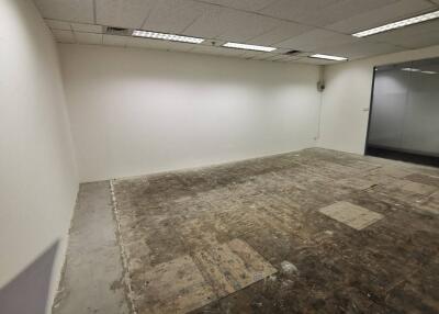 Empty office space with exposed flooring