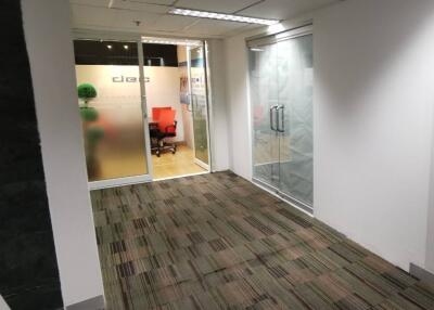 Office hallway with carpet and frosted glass doors