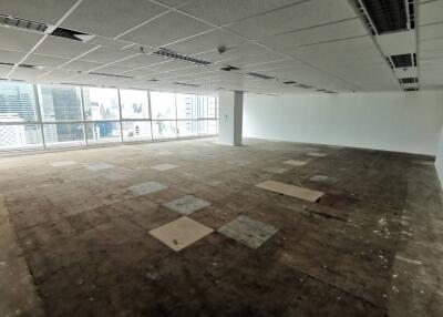 Spacious unfurnished open-plan office with city view