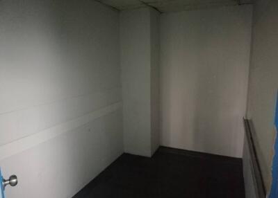 Empty room with white walls and a door