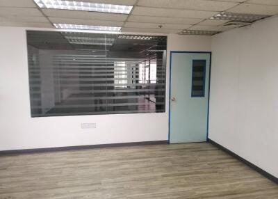 Empty office with glass partition and door