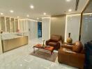 Modern living room with leather chairs and a decorative table