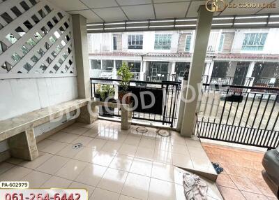 Spacious balcony area with tiled flooring and seating