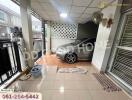 Carport with car and tiled floor