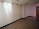 Empty room with wood laminate flooring