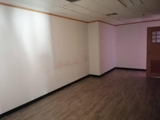 Empty room with wood laminate flooring