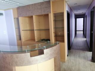 Office space with a reception counter and hallway