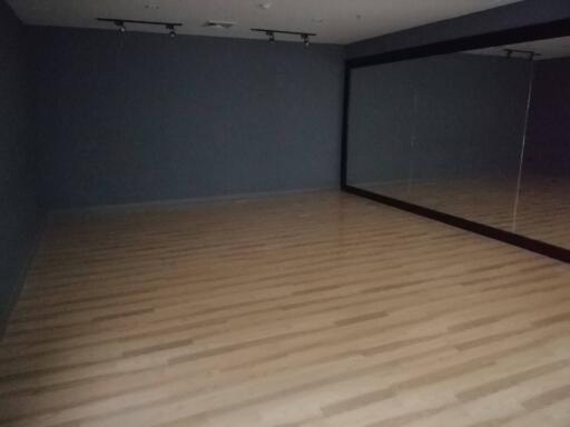 Empty room with large mirror