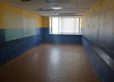 Empty room with blue and yellow walls