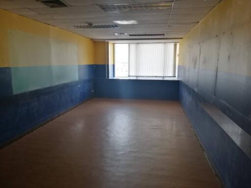 Empty room with blue and yellow walls