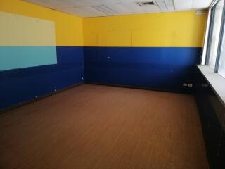 Empty room with yellow and blue walls