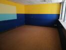 Empty room with yellow and blue walls