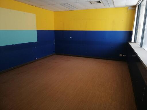 Empty room with yellow and blue walls