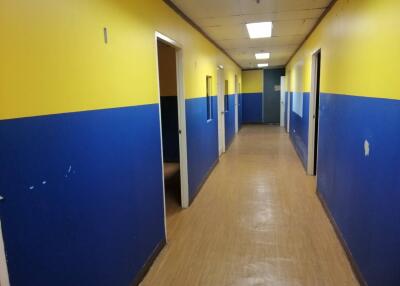 A hallway with blue and yellow walls