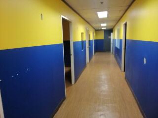 A hallway with blue and yellow walls