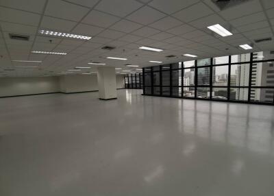 Spacious empty commercial office space with large windows