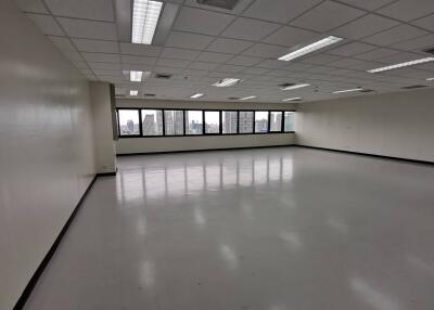 Spacious commercial area with large windows and ample lighting