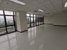 Spacious vacant office space with large windows