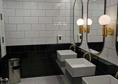 Modern bathroom with double sinks and decorative lighting