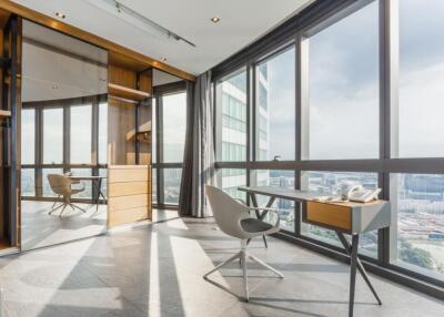 Modern office space with large windows and contemporary furniture