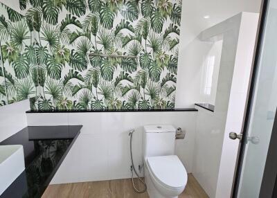 Modern bathroom with nature-themed wall tiles