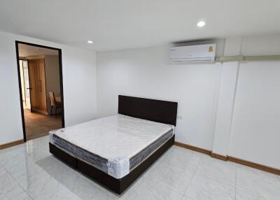 Modern bedroom with bed and air conditioning