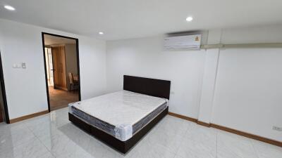 Modern bedroom with bed and air conditioning