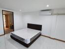 Modern bedroom with bed and air conditioning