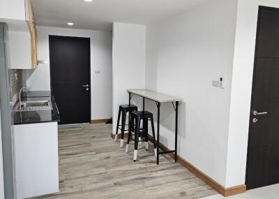 Minimalist kitchen with small bar area