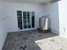 Rooftop area with water tank and glass doors