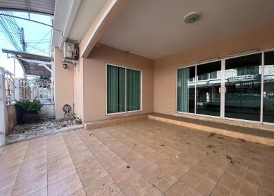 Covered patio area with sliding glass doors