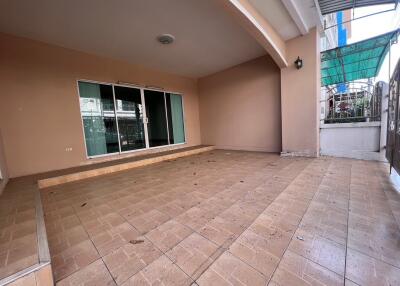 Covered outdoor patio with tiled flooring