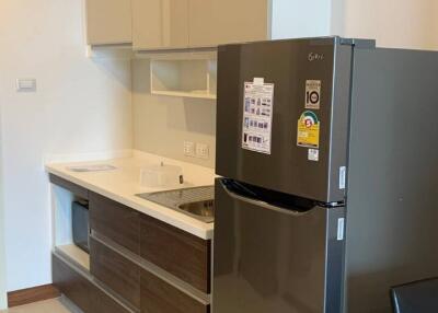 Modern kitchen with built-in cabinets and standard appliances