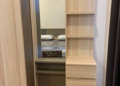 Bedroom with wooden wardrobe and shelves