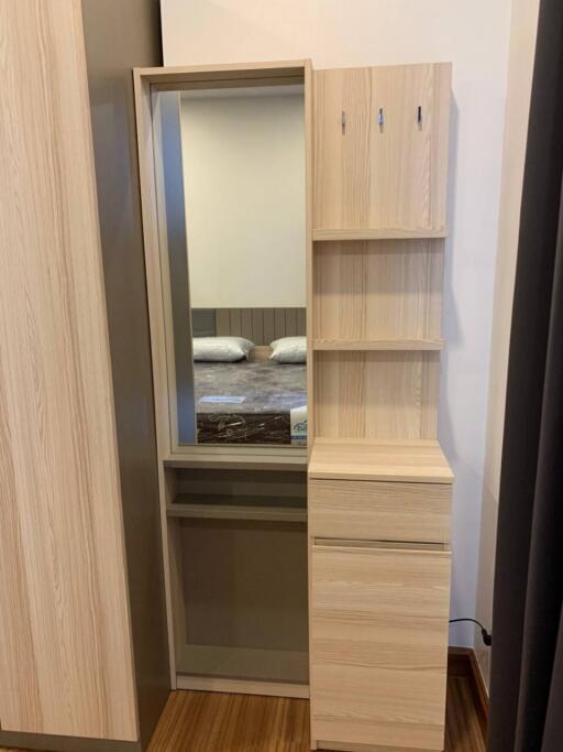 Bedroom with wooden wardrobe and shelves