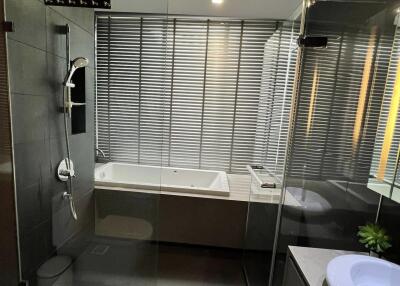 Modern bathroom with glass shower and bathtub